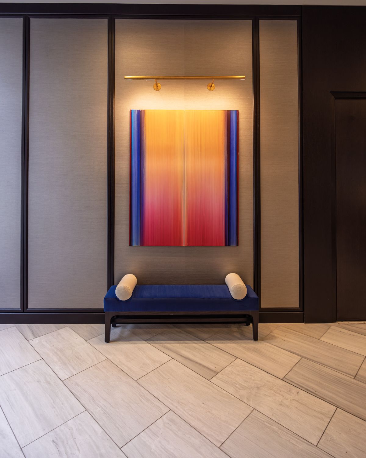 Attended residential lobby at 706 Mission with warm stone and millwork